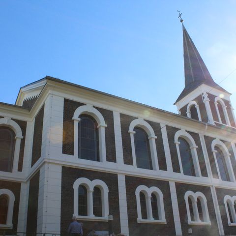 The building of the Evangelical Church under a blue sky in Erkrath